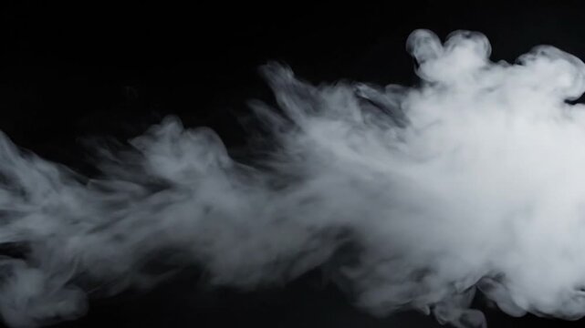 Dense white smoke billowing across a black background with a horizontal panning camera movement
