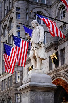 Statute of Benjamin Franklin in Washington DC with American Flag