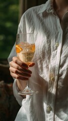 Savoring a delightful and refreshing drink while outdoors, absolutely perfect for creating summer vibes and relaxation