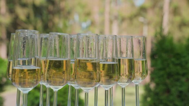Glasses of champagne on the street, slow motion