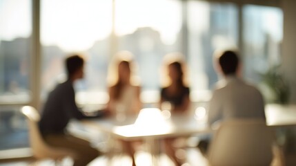 People collaborating during an office meeting, discussing business strategies with a soft background bokeh effect