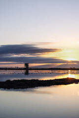 Obraz premium Sunset or sunrise on National park of Evros Delta, near Alexandroupolis and Turkish border, Dadia forest and protected wetland, bird migratory season