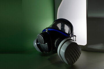 Exterminator&rsquo;s face mask with its filters, set in a colorful environment with colored lighting.