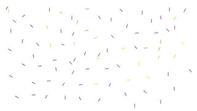 Colorful confetti sprinkles scattered randomly on a white background, creating a festive and joyful celebration atmosphere.