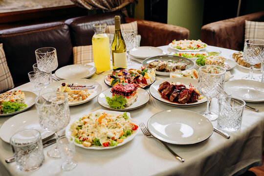 Festive banquet table with assorted gourmet dishes and elegant restaurant serving