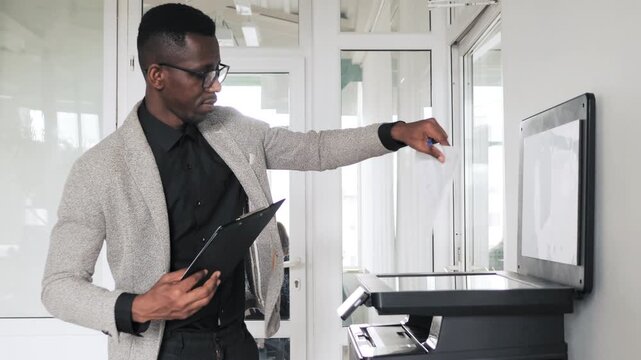 African american businessman scanning documents at the office