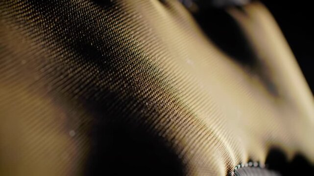 Detailed view of an industrial fabric with a focus on texture and pattern, evoking a sense of precision and mechanical elegance.