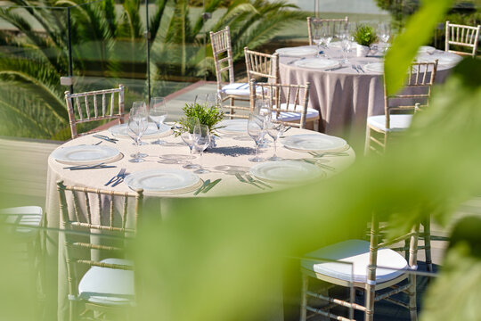 Outdoor wedding reception dinner table setup with elegant decor