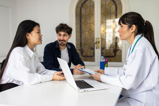 Doctor discussing health care treatment with patients