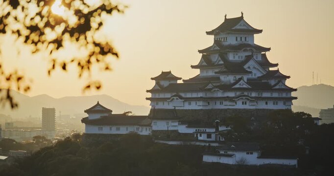Majestic, cinematic silhouette of 16th century crow castle in Japan - wide shot
