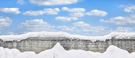 Beautiful snow-covered park wall in panorama format.