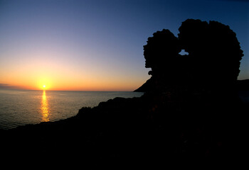 Tower of Bantine Sale at Sunset. Porto Ferro bay. Sardinia, Italy
