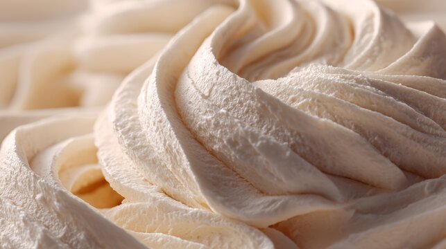 Close-up view of whipped shea butter forming textured swirls with soft lighting and a minimal background