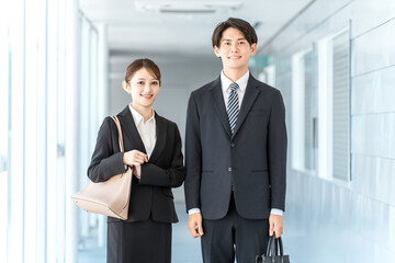 Young Asian male and female business people in suits (lawyer, tax accountant, accountant, civil servant, banker)