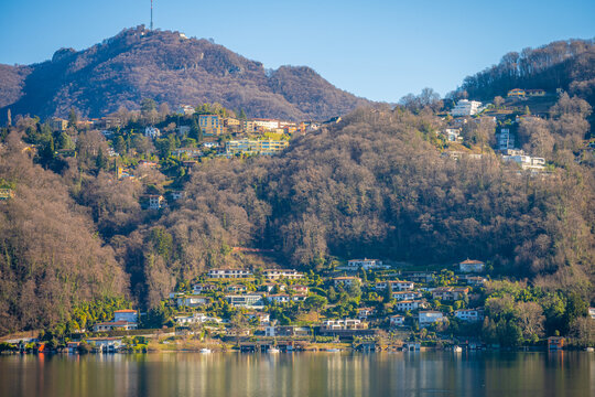 Hillside villas above the wooded slopes of Lake Lugano