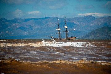 Fototapeta premium Wooden sailing ship in rough seas off the California coastline near Ventura California United States