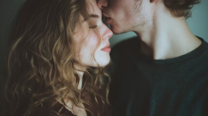 Man kisses a woman's face