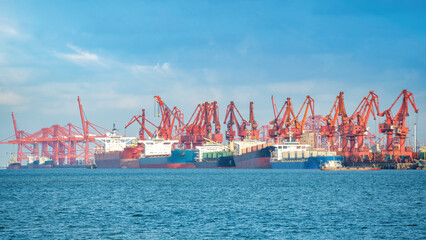 Cargo Ships and Cranes at Commercial Port
