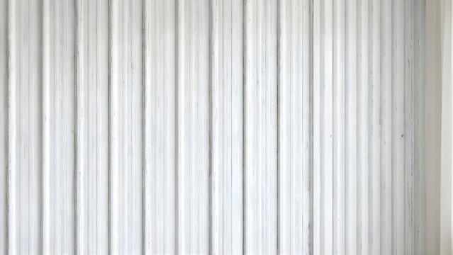 Seamless grey corrugated metal striped texture background with vertical lines and industrial steel surface pattern