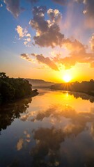 A serene landscape of a sunset over a body of water with trees