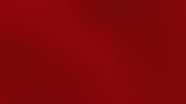 A plain red surface viewed from directly above showcasing a uniform color texture and pattern