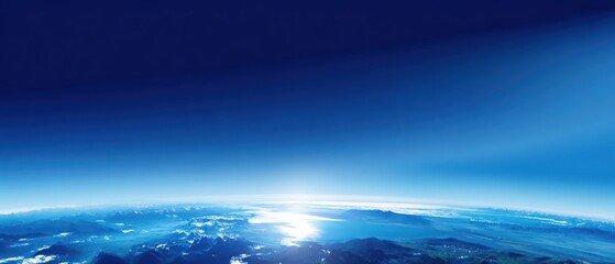 Fototapeta premium Blue planet curved horizon space backdrop Panoramic view of Earth horizon from space with blue atmosphere and sunlight over clouds