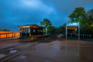 Naklejka premium Train tracks, at the Chepe train station at night, in the town of Areponamichic, Chihuahua