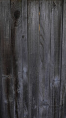 Naklejka premium Dark vertical wooden boards background texture