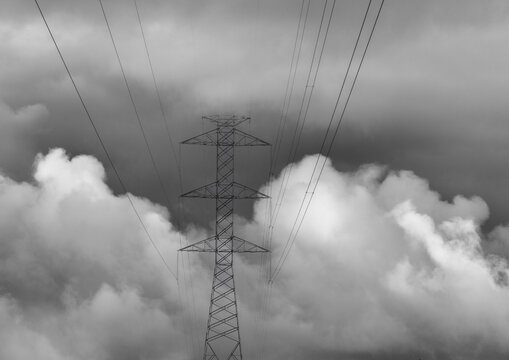 Power lines in the distant clouds, black and white.
