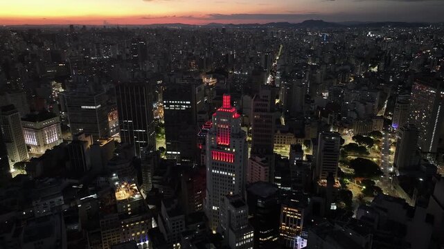 Sunset Santander Lighthouse At Sao Paulo In Brazil. Highrise Buildings Landscape. Downtown Cityscape. Sunset City. Santander Lighthouse At Sao Paulo In Brazil. Business Travel. Sao Paulo Brazil.