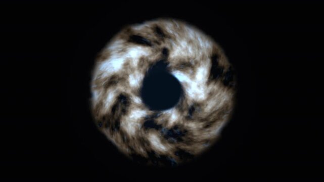 Particles swirl in a vortex against a black background