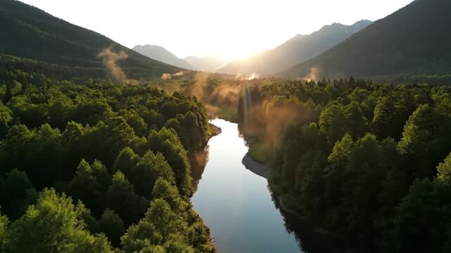 Serene river winding through lush green forest surrounded by majestic mountains with sunrise creating a misty atmosphere