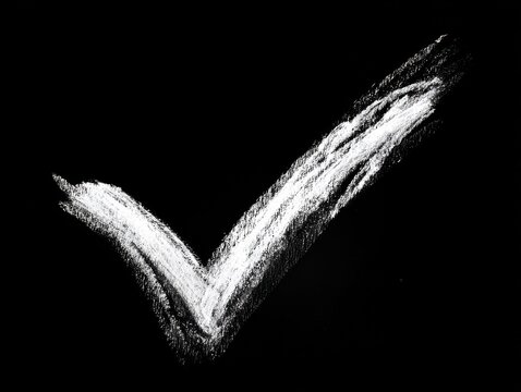 check mark hand drawn isolated on a black background