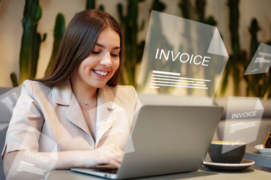 Woman working on banking invoice payment at a coffee shop in the afternoon