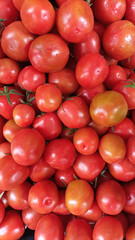 A vibrant close up view of freshly harvested ripe red tomatoes