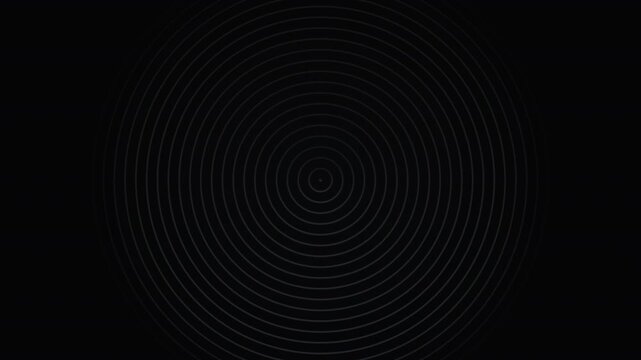 Rings expand outward from center on black background
