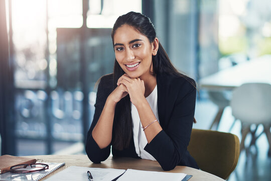 Business, woman or happy with documents in office for trial preparation, evidence review or about us. Law firm, attorney and portrait with paperwork at desk for drafting contract and case management