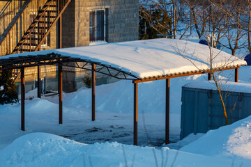 A snow covered roof with a metal frame