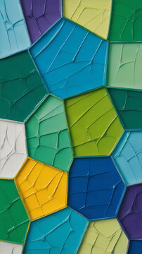 Textured abstract art featuring a tessellating pattern of geometric shapes filled with rich oil paint in vibrant blue, green, and yellow hues.