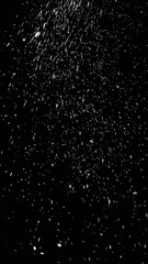 Obraz premium Perfect vertical fire particles embers sparks on black background . Texture overlays.