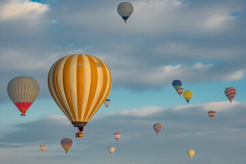 Naklejka premium Colorful hot air balloons flying above Nevsehir Cappadocia fairy chimneys