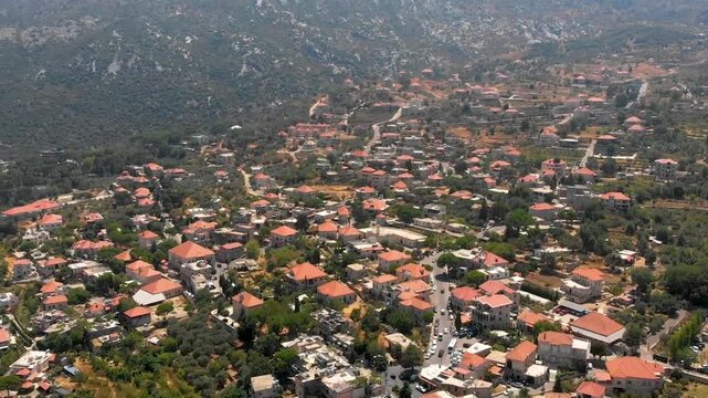 Drone video of Douma, Lebanon, framed by mountains and greenery, perfect for tourism promotions, lifestyle visuals, and cultural storytelling.