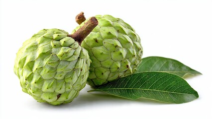Two ripe green custard apples with leaves on white background