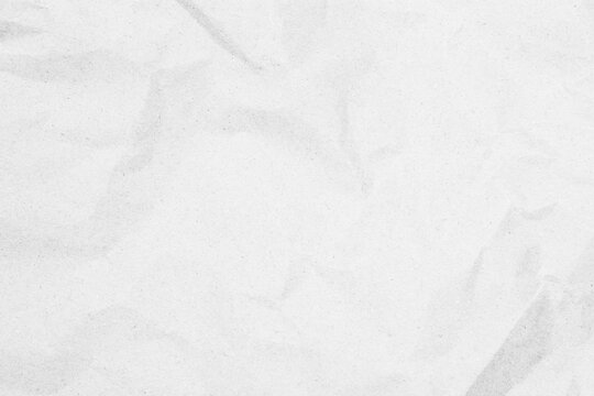 White recycled craft paper texture as background. Grey paper texture, Old vintage page or grunge vignette of old newspaper. Pattern rough art creased grunge letter. Hardboard with copy space for text.