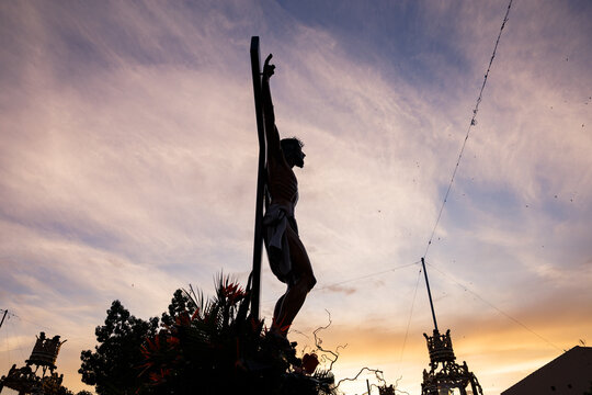 Dramatic Silhouette of Jesus During Procession
