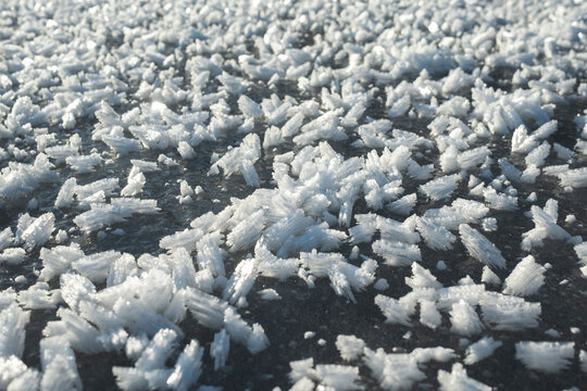 Ice crystals form on a frozen lake