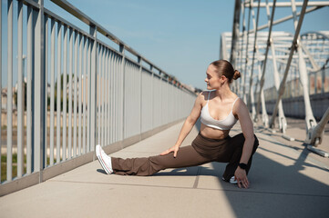 Fitness Woman Stretching on Bridge
