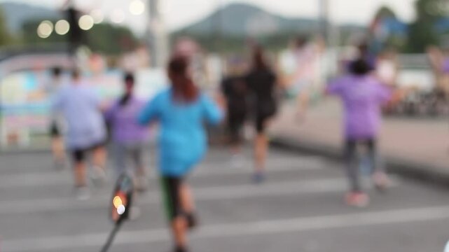 Blurred image of elderly people exercising in a park
