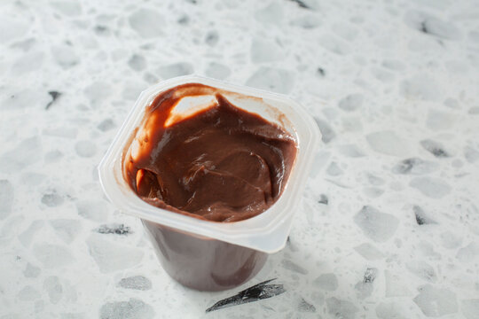 A closeup view of a chocolate pudding cup.