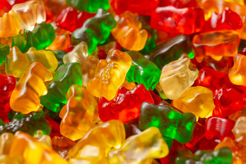 A top down view of a pile of gummy bears, as a background.